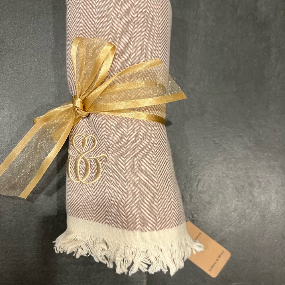 Beautiful soft cream and blush colored wrap.